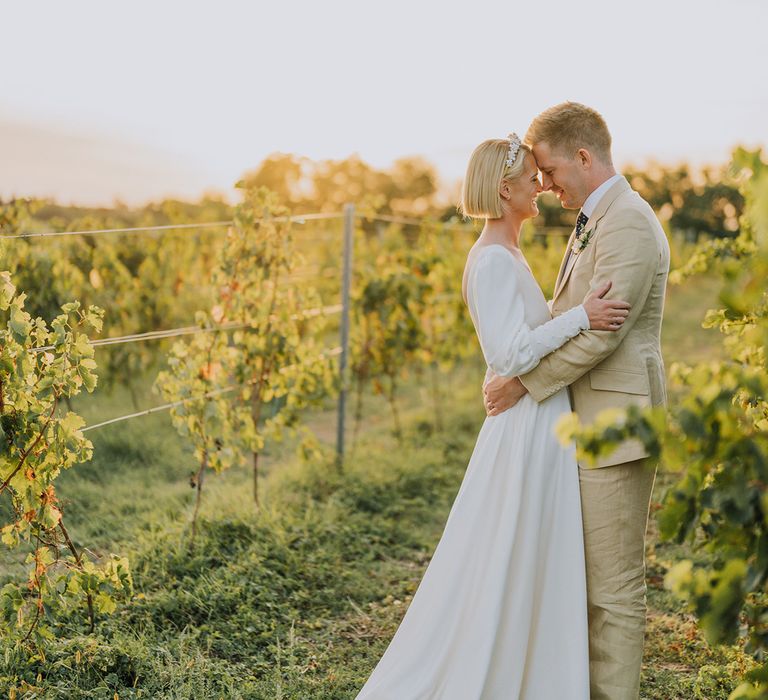 golden hour bride and groom photographs at Château de Malliac with bride in a Emma Beaumont wedding dress and groom in a beige suit