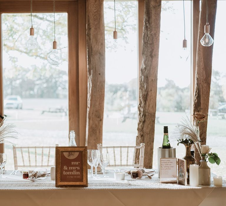 Wedding sweetheart table for the bride and groom to sit for the wedding breakfast at Colville Hall 