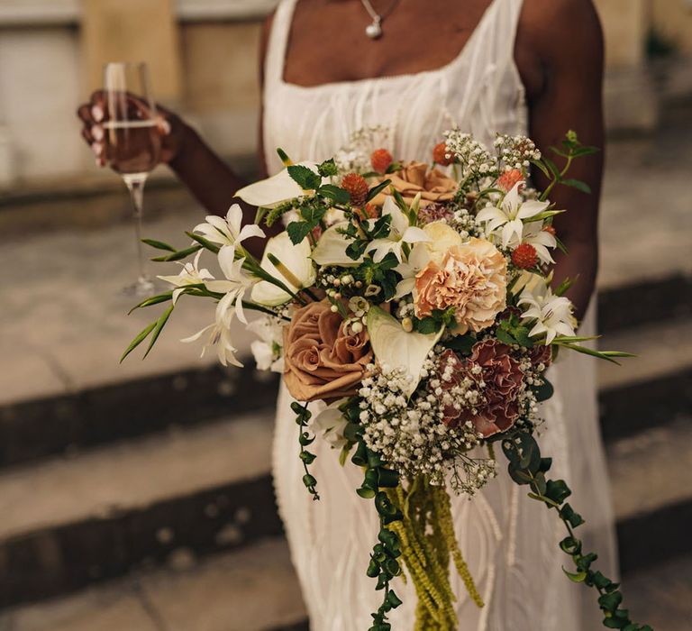 Bride holding stunning wedding bouquet for classic and sophisticated wedding day 