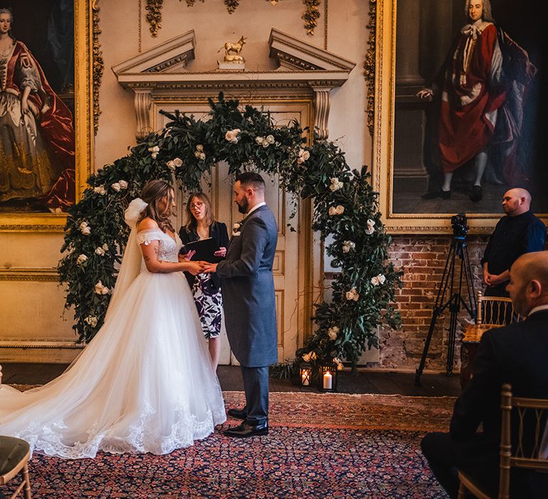 Christmas tree and traditional white flower arch altar decor for country house wedding for bride and groom 