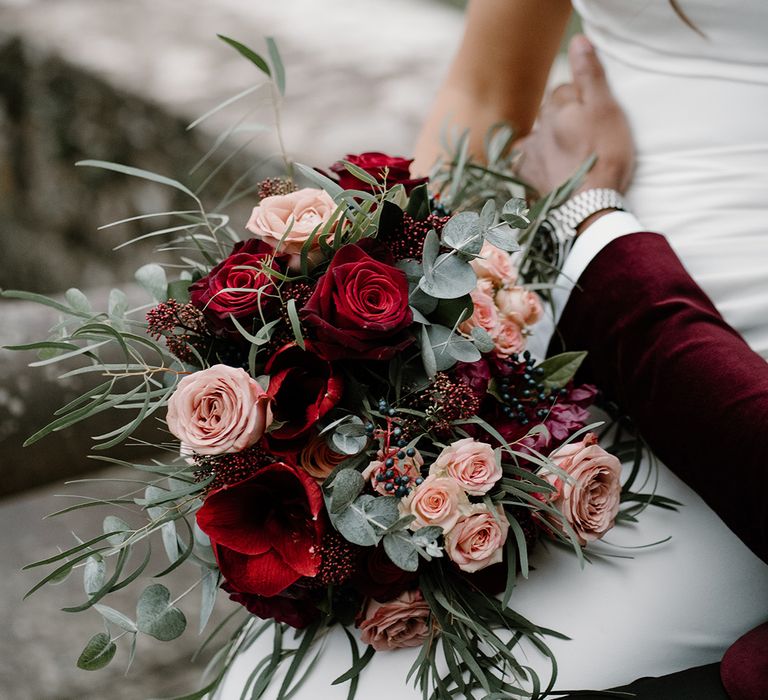 Pink and red rose winter wedding bouquet for the bride 