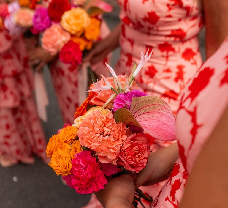 Pink, orange and yellow wedding flowers in mini bridesmaid bouquets 