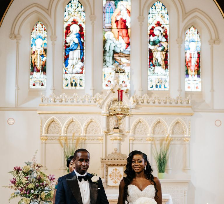 Catholic wedding ceremony with bride in fishtail wedding dress