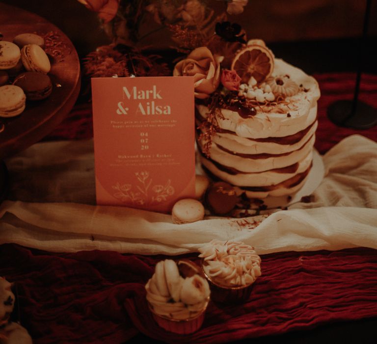 Meringue tower wedding cake and orange wedding sign 