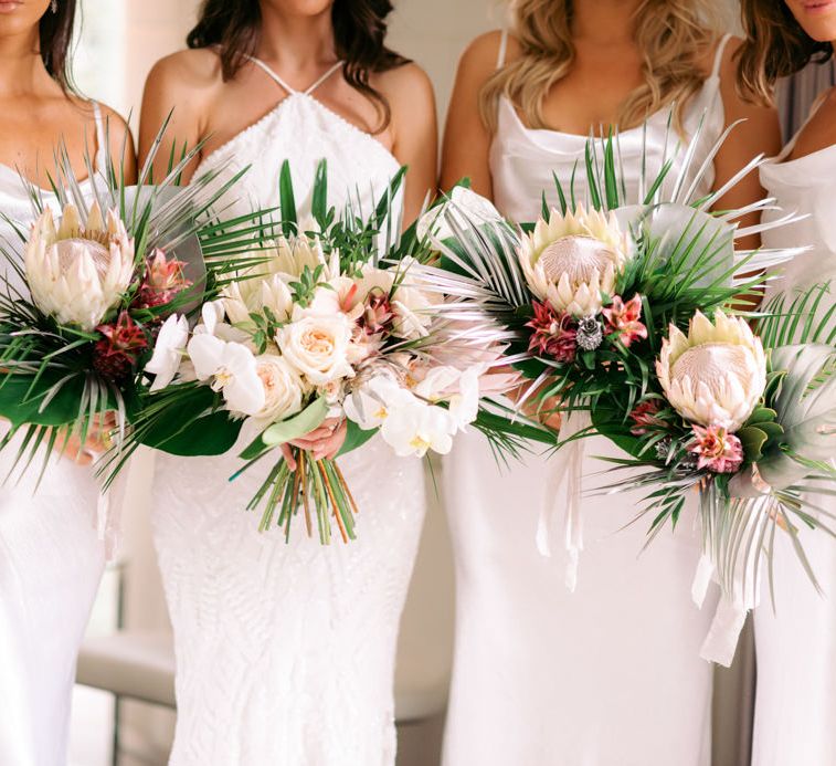 King Protrea wedding bouquets held by bridal party 