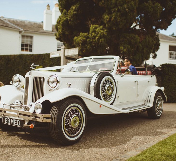 Vintage white wedding car 