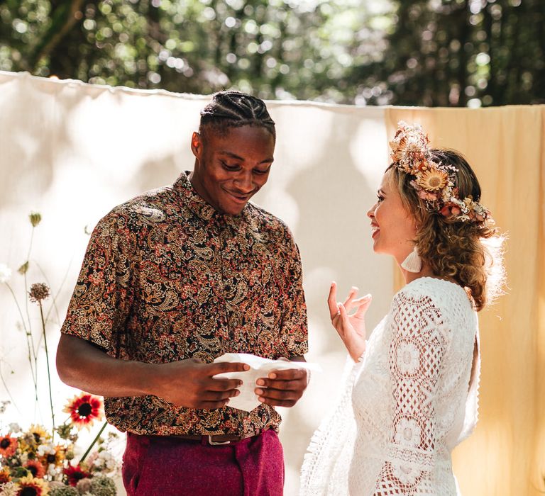 Bride & groom during wedding ceremony at Longton Wood