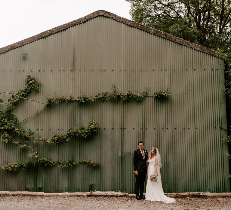 Bride and groom wedding photography at Clock Barn wedding venue 