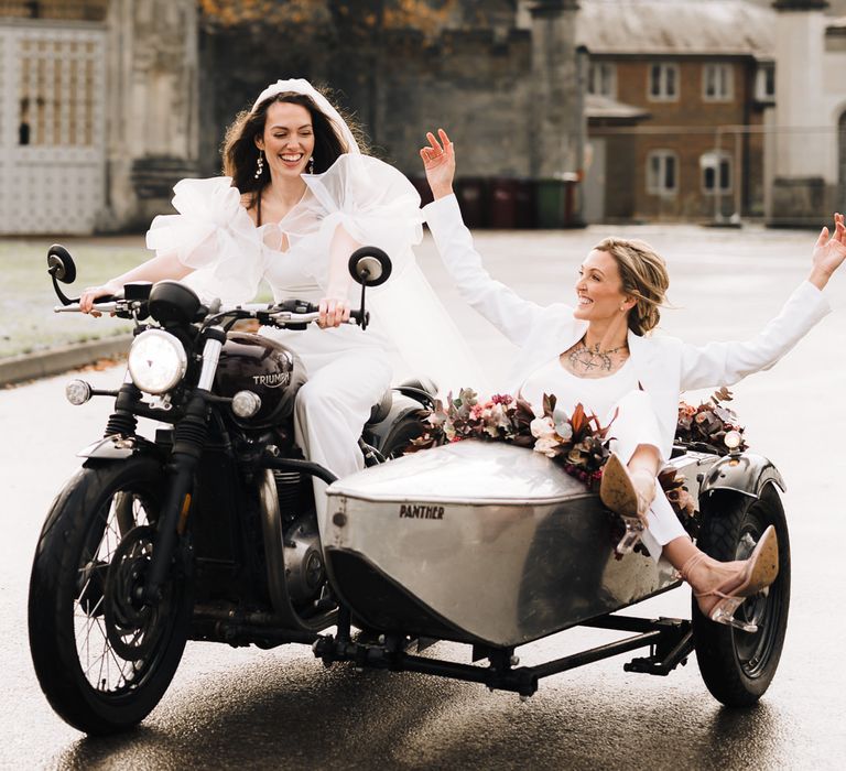 Lesbian couple in a wedding side car and motorbike 