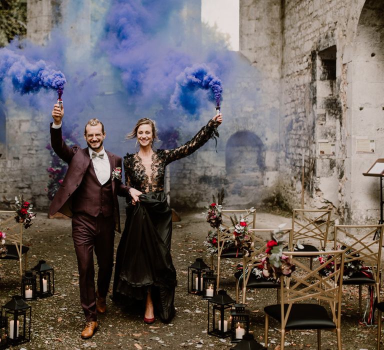 Purple smoke bomb portrait for gothic style wedding in a medieval abbey 