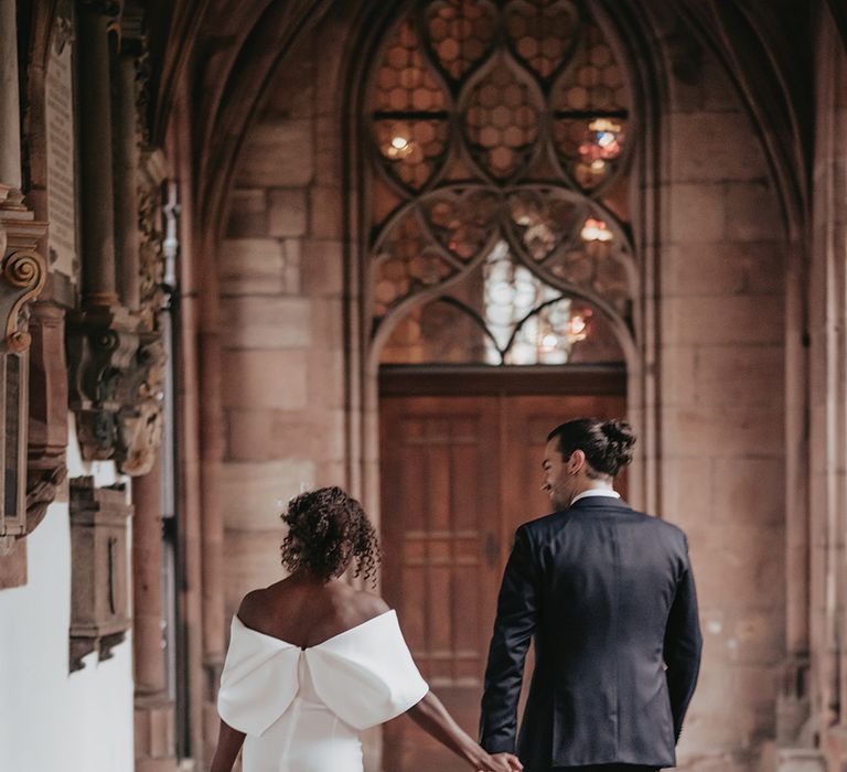 Bride & groom walk together after wedding ceremony