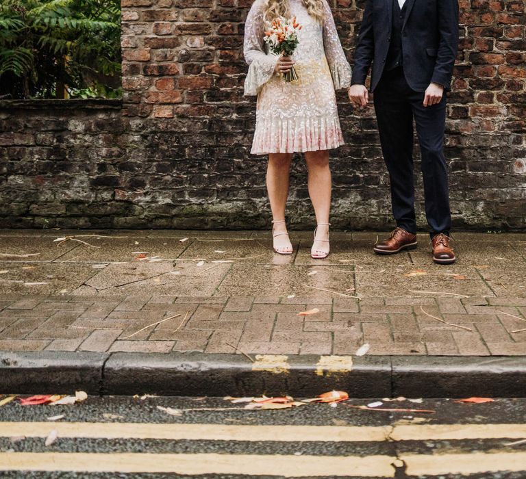 Intimate wedding in Manchester - bride and groom holding hands