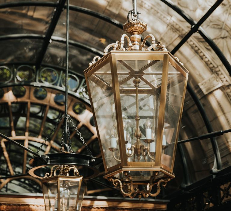 Large gold lantern hangs from the outside of The Landmark Hotel entrance 