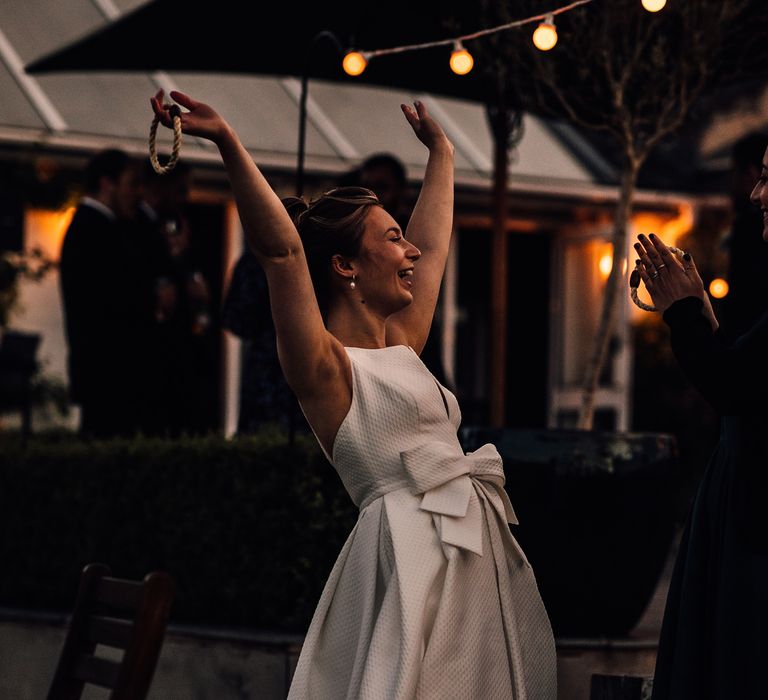 Bride celebrates outdoors on her wedding day