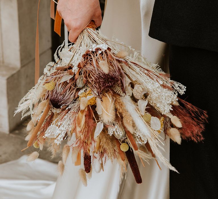 Dried flower wedding bouquet with grasses, billy bobs, poppy heads and more