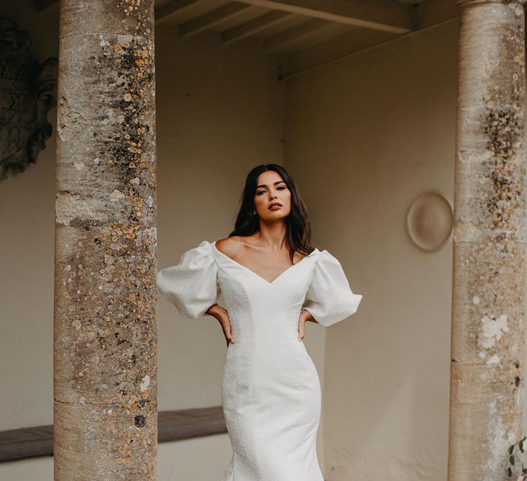 Bride in a fishtail wedding dress with puff sleeve from the new Suzanne Neville Nova 2022 bridal collection