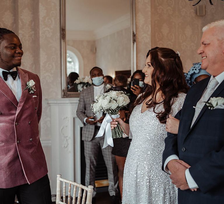 Bride & groom look lovingly at one another on their wedding day