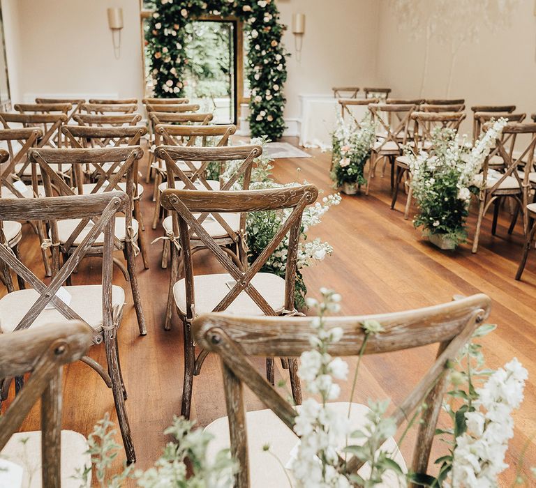 Foxhill Manor wedding ceremony decor with floral arch and aisle wedding flowers 