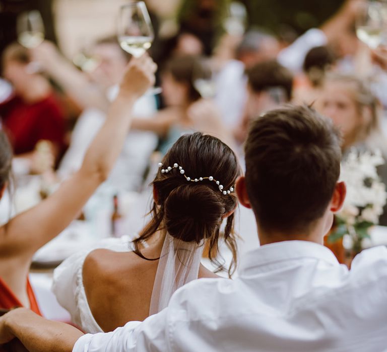 Bride and groom seated at dinner