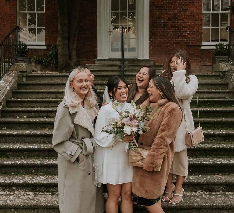 Wedding guests surrounding bride in Vanessa Cocchiaro wedding dress 