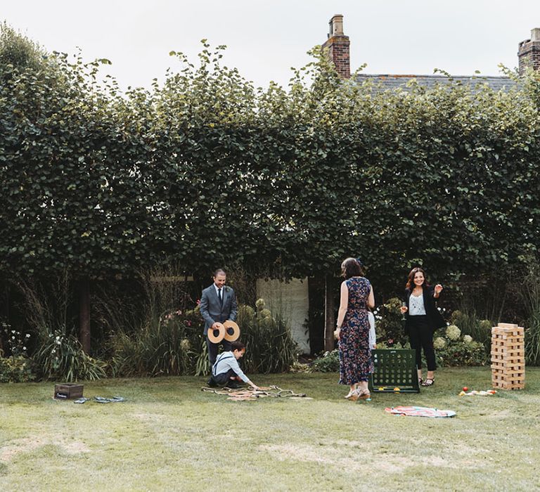 Wedding guests play outdoor games for their wedding entertainment 