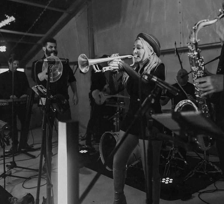 Brass band wedding entertainers at clear glass marquee wedding reception 