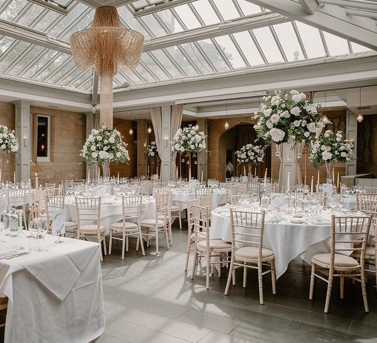 Hampton Manor reception complete with white floral installation centrepieces 