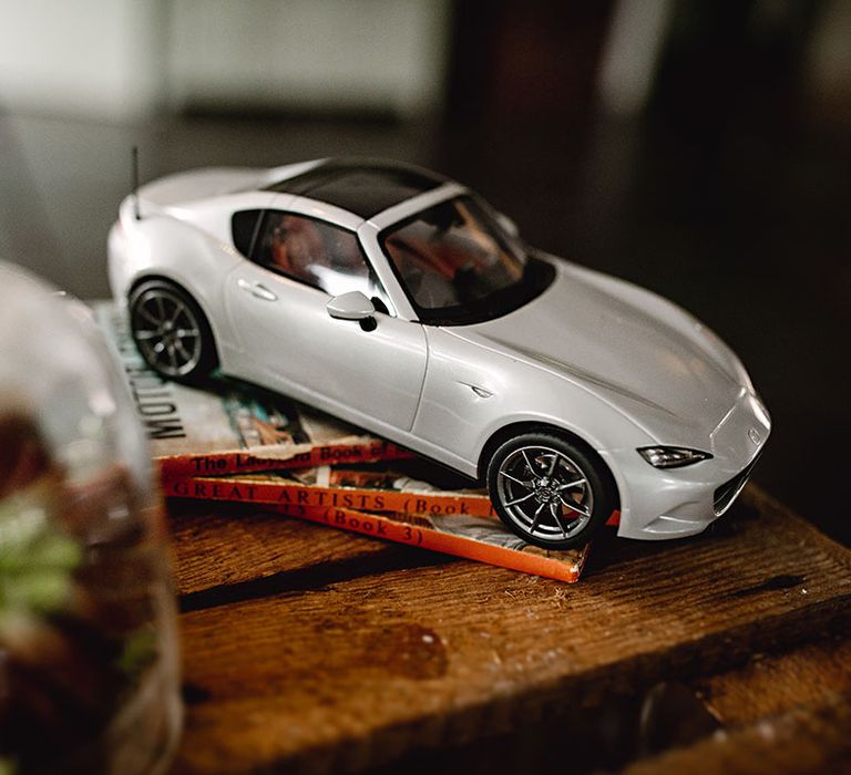 Toy silver Porsche car 