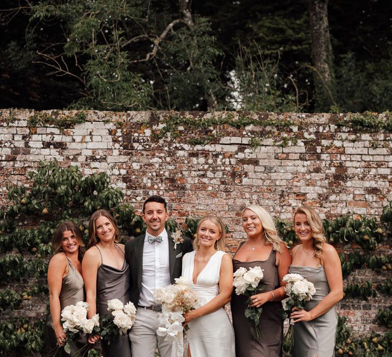 Mixed gender wedding party with the bride for the boho luxe wedding at Pythouse Kitchen Gardens