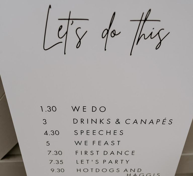 Clean simple and minimal order of the day wedding sign 