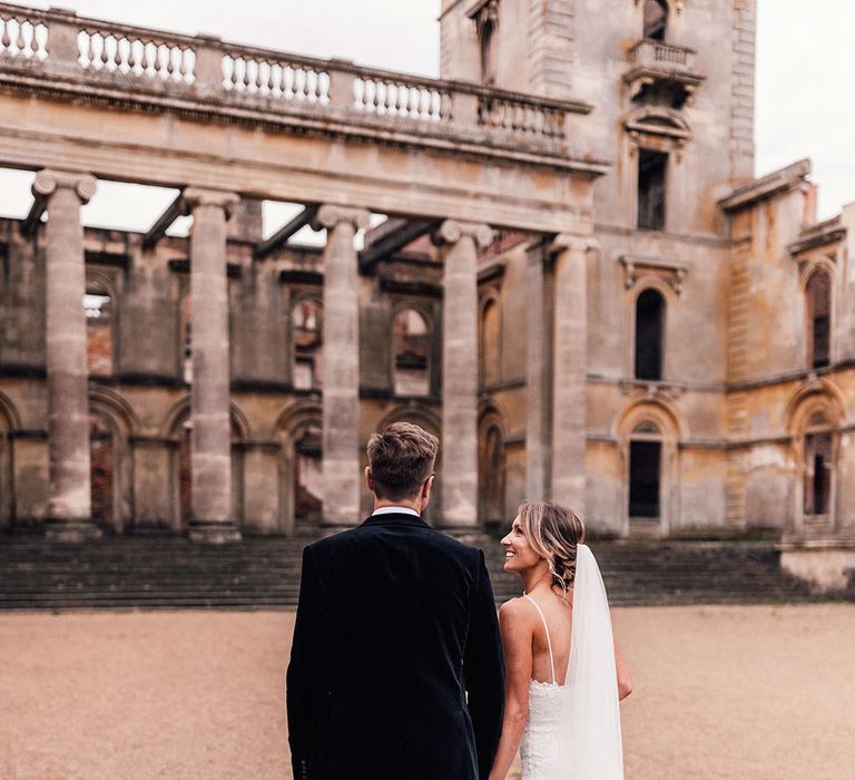 The incredible Hanley Hall in Worcestershire with the bride and groom walking around the grounds 