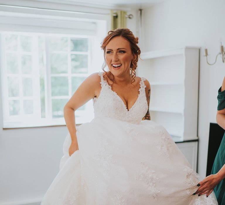 Bride in a lace wedding dress on the wedding morning 