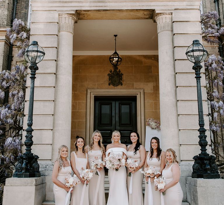 Hedsor House country house wedding venue with bridesmaids in pale pink bridesmaid dresses 