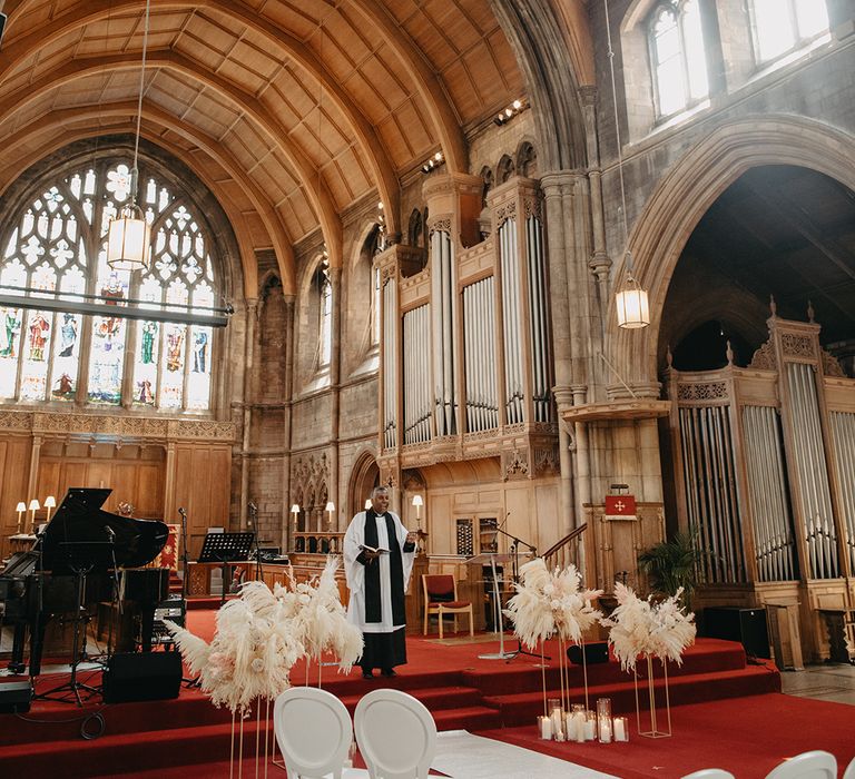 Traditional church wedding ceremony with blush pink and white boho dried wedding flowers 