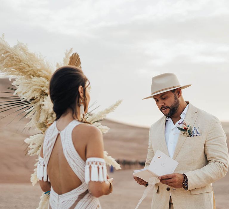 Groom wearing beige neutral wedding hat for wedding ceremony in Morocco 