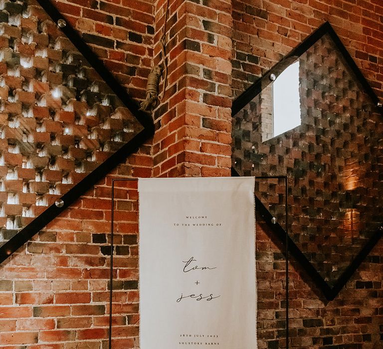 Minimalist black and white fabric wedding welcome signage 