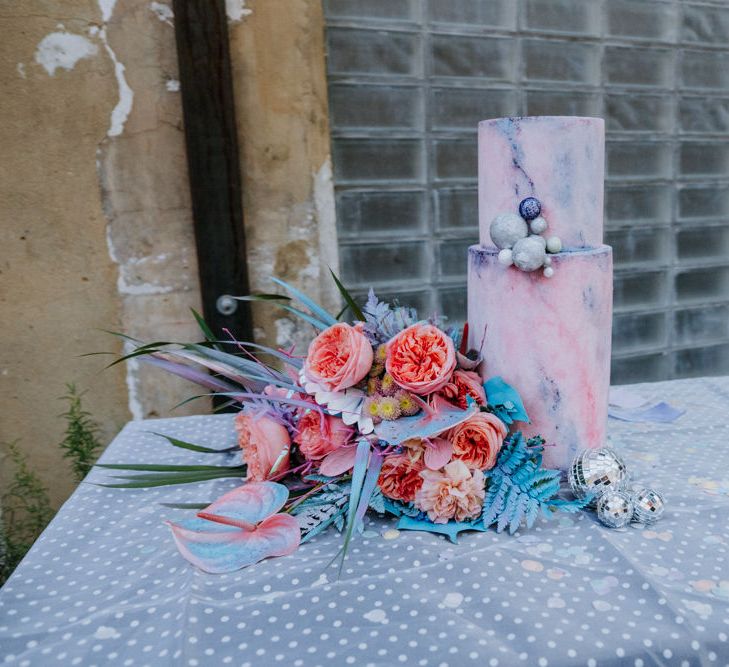 Wedding cake and bouquet in holographic pastel colours 