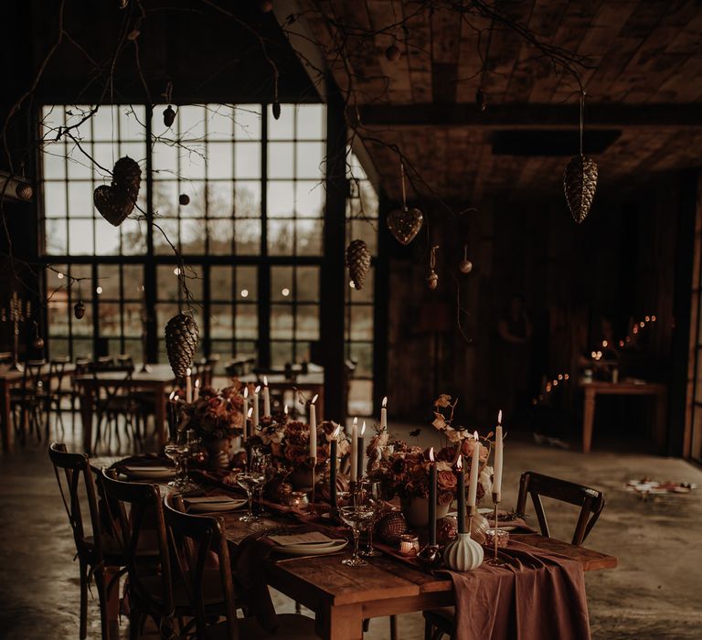 Intimate Christmas wedding inspiration tab escape with candles and bauble installation