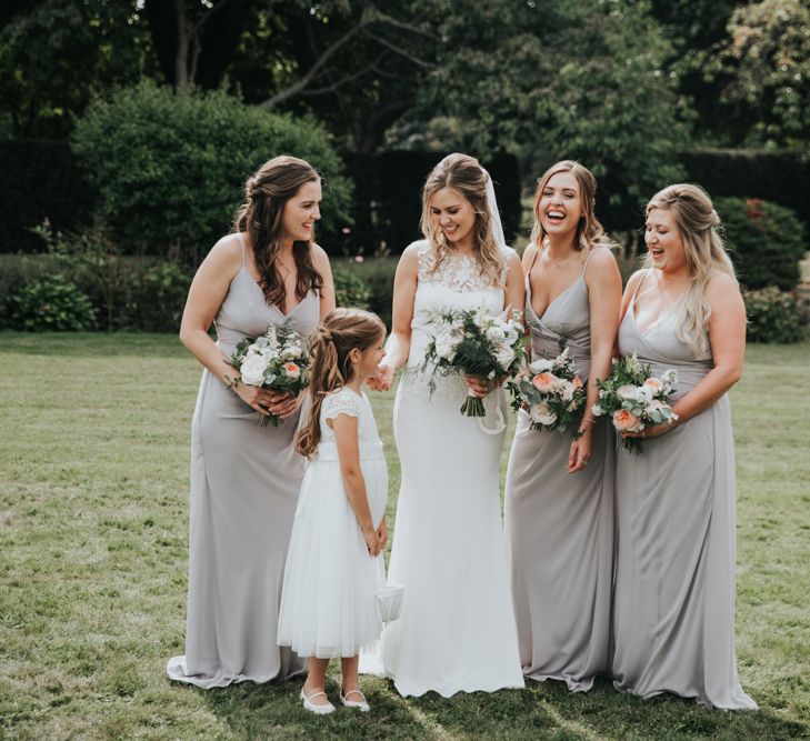 Bride, bridesmaids and flower girl at Notely Abbey classic wedding