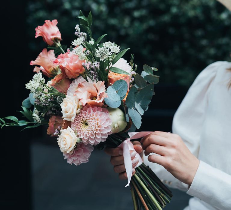 Pink and coral bridal bouquet with eucalyptus 