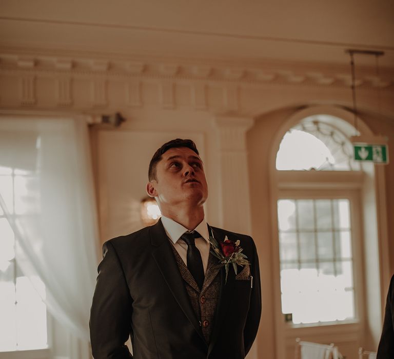 Groom waits for his bride at civil ceremony