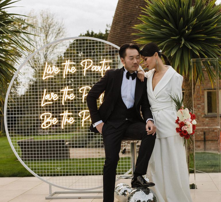 Disco balls and neon signs for a contemporary, stylish wedding