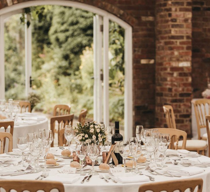 DIY flower centrepiece decor at Northbrook Park wedding reception 