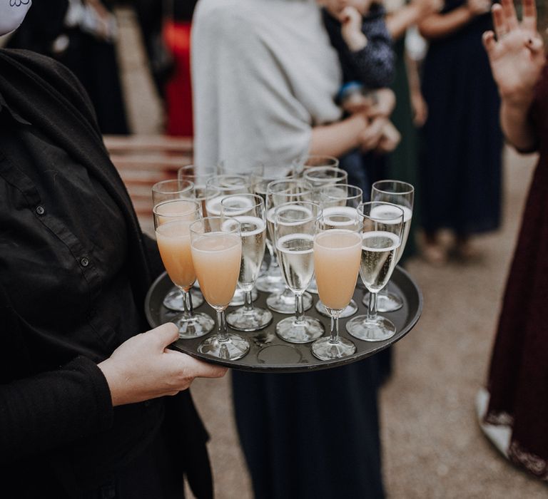 Tray of sparkling wine at rural German wedding reception