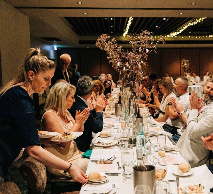 Wedding guests enjoy the speeches