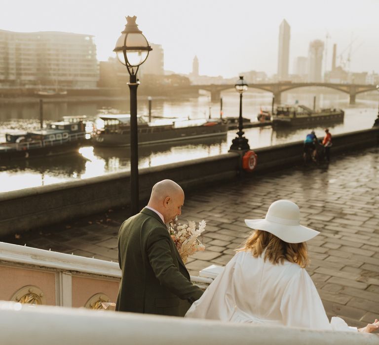 Bride & groom walk through London with one another