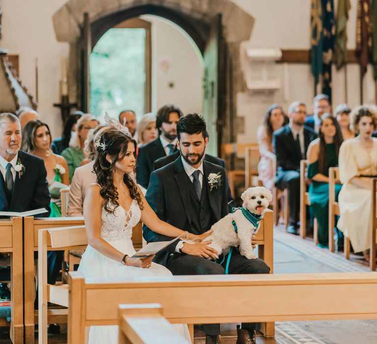 Wedding guests gather in church for seaside wedding