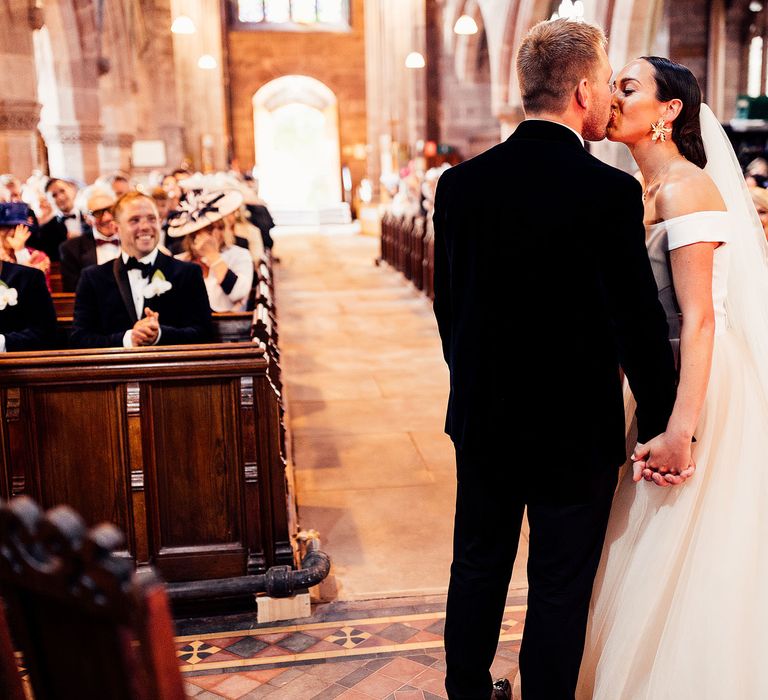 Bride and groom share first kiss as husband and wife