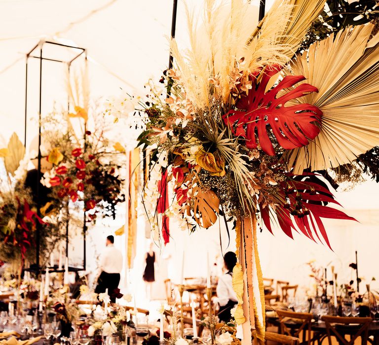 Dried palm leaves and balloon wedding decor