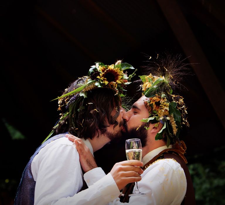 Grooms kiss on their wedding day